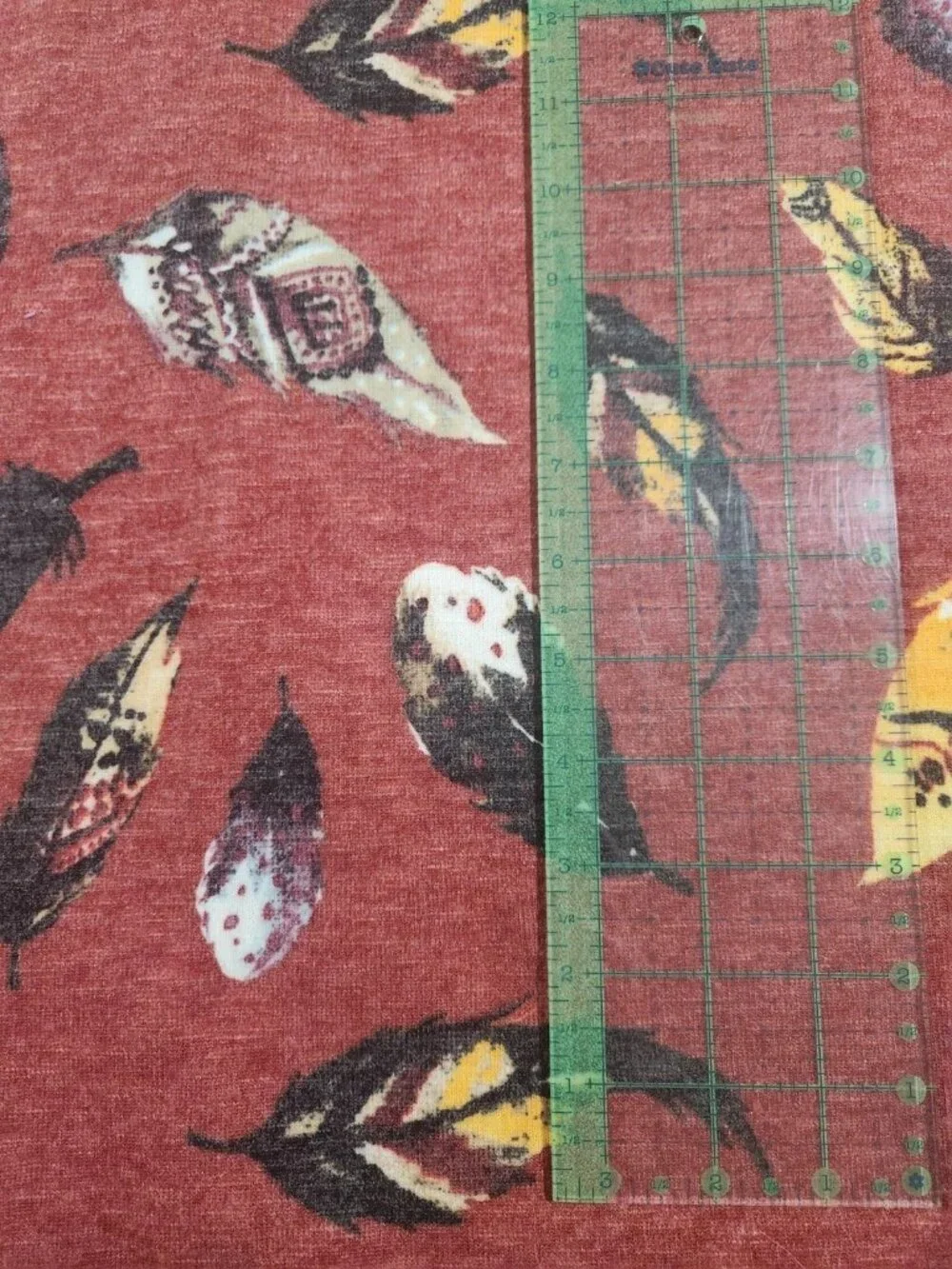 2+ yards Hacci Knit Fabric Reddish-Rust with Feathers ... Beautiful!